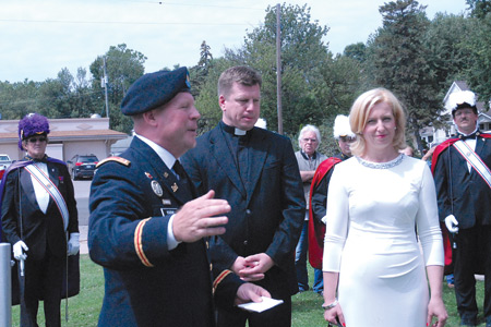 Fr. Maka, who was born in Poland, is seen with his sister, Teresa, and brother-in-law, U.S. Army Maj. Ken Kozak, during his swearing-in ceremony.