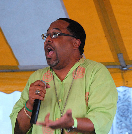 Evangelist Richard Lane, a Detroit native who travels the country giving parish missions and revivals, implores parishioners July 26 at St. Charles Lwanga Parish in Detroit take the message of Christ in the city's streets.