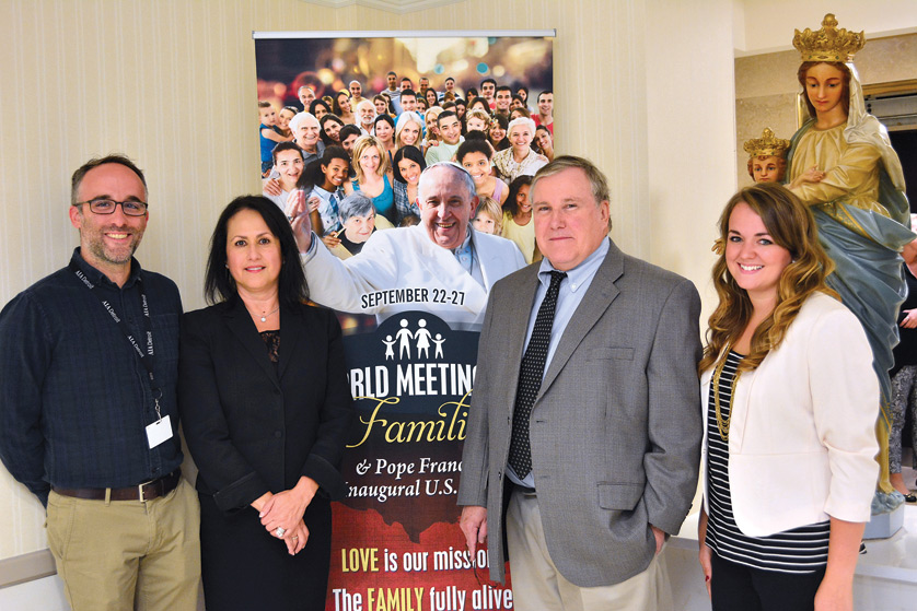 Left to right, Tim Hinkle, Patricia Maldonado, Ned McGrath, and Annie Schunior from the Archdiocese of Detroit's Department of Communications will travel to Philadelphia, New York, and Washington D.C., to help facilitate and document Pope Francis' first visit to the United States while representing local Catholics during the historic trip. Mike Stechschulte | The Michigan Catholic