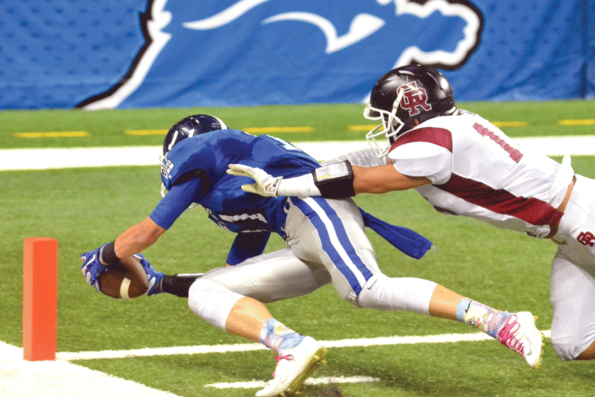 A Lakers player dives for the goal line during Waterford Our Lady of the Lakes' 49-28 victory over Riverview Gabriel Richard for the Prep Bowl C-D championship October 25. Mr. Mack Photography