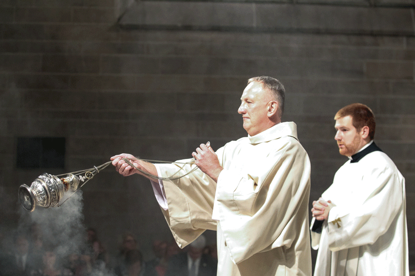 Deacon John Fitzmaurice swings the thurible to incense the altar before the consecration during his Mass of ordination at the Cathedral of the Most Blessed Sacrament on Oct. 3. Deacon Fitzmaurice was one of five permanent deacons - four for the Archdiocese of Detroit - ordained by Archbishop Allen H. Vigneron. 