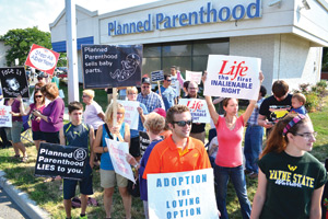 Hundreds protest outside a Planned Parenthood clinic in Warren in August over revelations the abortion giant had been involved in allegedly selling body parts of aborted babies. Mike Stechschulte | The Michigan Catholic