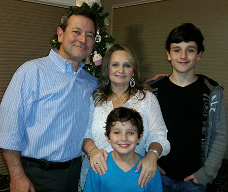 Jorge and Linda Rollan are pictured with their two sons, Alejandro and Lucas, at their family home in Wayne. Lucas, a second-grader at St. Mary School in Wayne, rescued his mother in early November by jumping into action and calling his father during a medical emergency. Family Photo