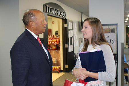 University of Detroit Mercy president Antoine M. Garibaldi, Ph.D., talks with a student outside the campus "Titan-to-Go" market. Garibaldi said since the university's partnership with the Archdiocese of Detroit in 2014, Catholic school enrollment and applications have increased substantially. Photo by University of Detroit Mercy