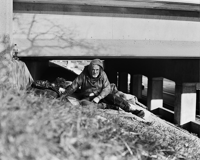 A homeless man sits up from his mat under a freeway overpass in Detroit during the cold winter months. Advocates say Detroit has made progress in recent years by collaborating with local agencies to improve the situation for the city’s homeless, but much more can still be done for the 15,000 living on Detroit’s streets.