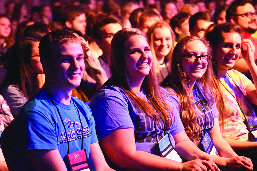 Young people from Holy Innocents-St. Barnabas Parish in Eastpointe laugh during Chris Padgett’s talk Jan. 31 at the CYO Rainbow Conference in Detroit.