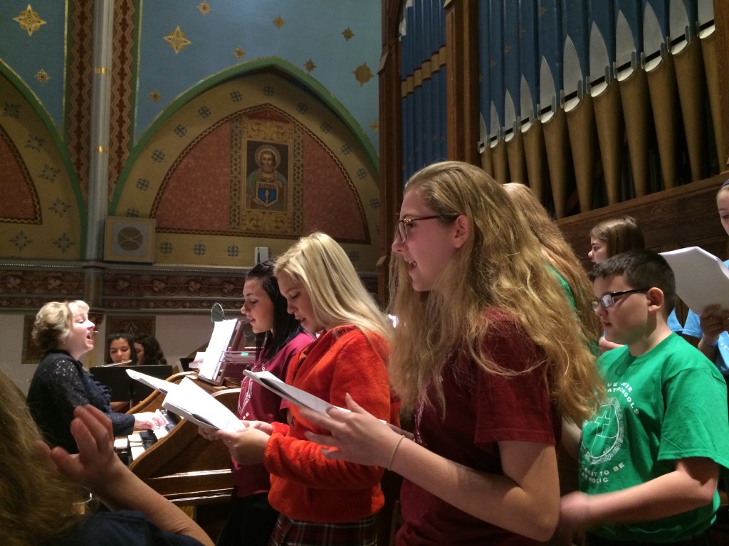 Students sing during Mass for Catholic Schools Week at Holy Cross Church in Marine City. (Photos courtesy of Marine City Cardinal Mooney High School)