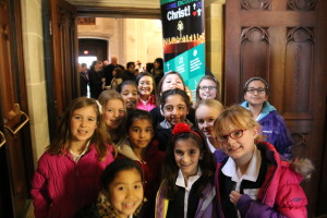 Catholic school students enter the Cathedral of the Most Blessed Sacrament through the Holy Door of Mercy at the start of Mass.