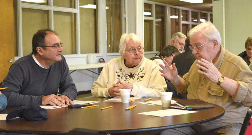 Parishioners discuss ways to better communicate the message of the Gospel during a parish dialogue gathering April 10 at St. Robert Bellarmine Parish in Redford. St. Robert Bellarmine was one of the first in the archdiocese to host a dialogue session, which will help the Archdiocese of Detroit gather information that will be connsidered during the archdiocesan synod this fall. Dan Meloy | The Michigan Catholic