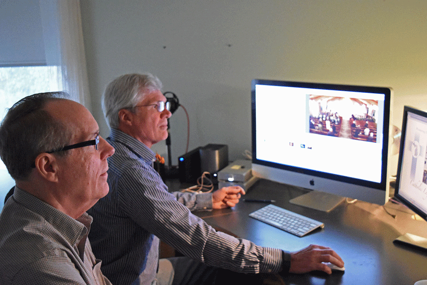 Thomas Byrne, left, and Norm Fankell edit footage as part of a project for Catholic Legacy of Michigan, which seeks to tell the Church's story through locally produced documentaries. Dan Meloy | The Michigan Catholic