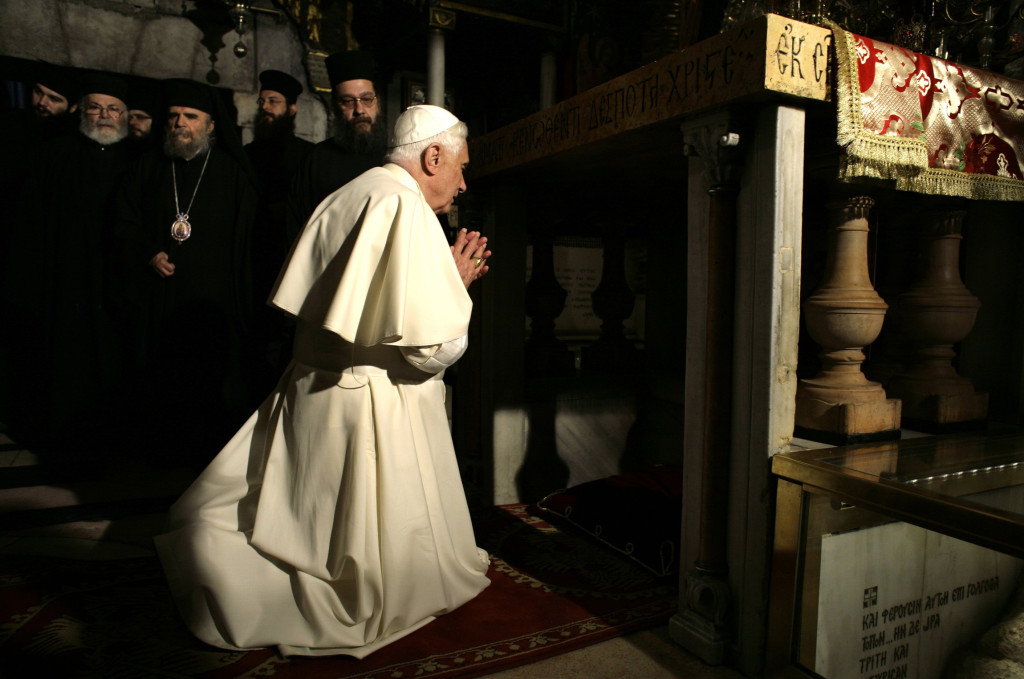 Pope Benedict XVI prays at Golgotha, or Calvary, the traditional site where Jesus was crucified, in the Church of the Holy Sepulcher in 2009. (CNS photos by Yannis Behrakis)