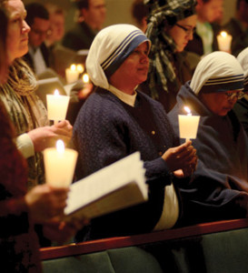 Missionaries Sisters of Charity hold candles during the Easter Vigil at the Cathedral of the Most Blessed Sacrament. (Joe Kohn | Archdiocese of Detroit)