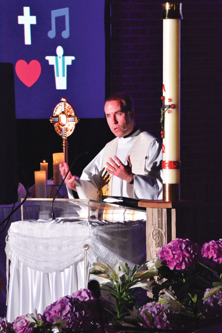 Fr. Tim Birney, director of priestly vocations for the Archdiocese of Detroit, preaches during "Come, Encounter Christ!" at St. Ephrem Parish in Sterling Heights.