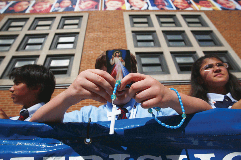 While the "Hail Mary" forms the "background music" of the rosary, the focus of this intensely biblical prayer is very much on the life of Christ, just like music at a graduation ceremony complements - rather than distract from - the accomplishments of the graduates. Eric Thayer | CNS Photo