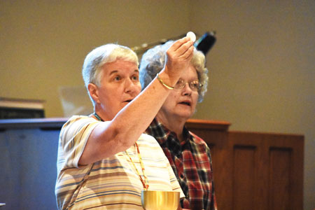 Sr. Mary Downey, IHM, leads a Communion service for residents at Henry Ford Village in Dearborn. The senior community features a permanent chapel that functions as a satellite campus for St. Alphonsus - St. Clement Parish in Dearborn, complete with a 24/7 tabernacle with the Blessed Sacrament reserved. Photos by Dan Meloy | The Michigan Catholic