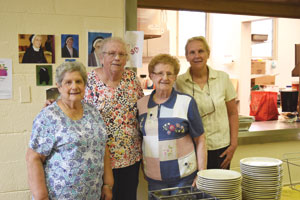 Frances DeLuca, Kay Shaw, Irene Peczynski, and Jan Armstrong are members of the St. Christoper-St. Thomas Aquinas Parish altar society, which cleans the church after Mass, prepares a catered meal for the Senior Club and completes small tasks around the parish.