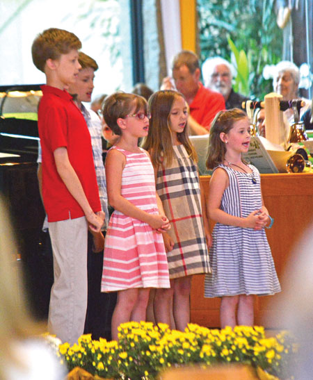 A children's choir accompanies the bell choir during St. Hubert Parish's 50th anniversary Mass on June 18 in Harrison Township. Mike Stechschulte | The Michigan Catholic