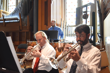 Trumpet players accompany the alumni choir at St. Raymond/Our Lady of Good Counsel Parish in Detroit during a 75th anniversary Mass on June 5. Dan Meloy | The Michigan Catholic