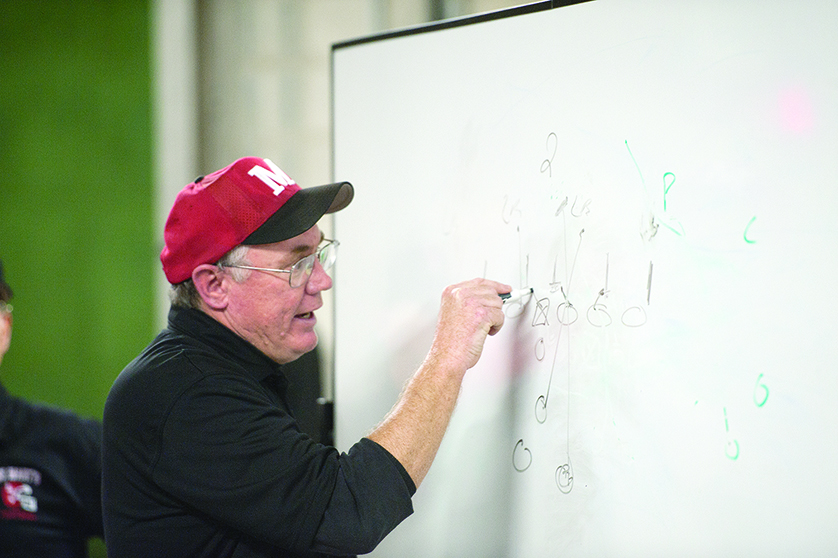 Eaglets coach George Porritt draws up plays in this 2011 file photo. Orchard Lake St. Mary’s will kick off the 2016 football campaign Aug. 25 against Macomb Township Dakota High.