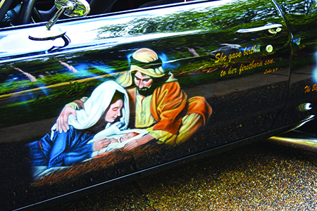 Starting from the front driver’s side quarter panel, Dennis Hatmaker’s car depicts 10 scenes from salvation history, starting with the Annunciation and ending with Pentecost, as well as images of the Sacred Heart of Jesus, Our Lady of Grace and quotations from sacred Scripture. To see more photos, visit gallery.themichigancatholic.com.