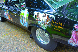 Starting from the front driver’s side quarter panel, Dennis Hatmaker’s car depicts 10 scenes from salvation history, starting with the Annunciation and ending with Pentecost, as well as images of the Sacred Heart of Jesus, Our Lady of Grace and quotations from sacred Scripture. To see more photos, visit gallery.themichigancatholic.com.