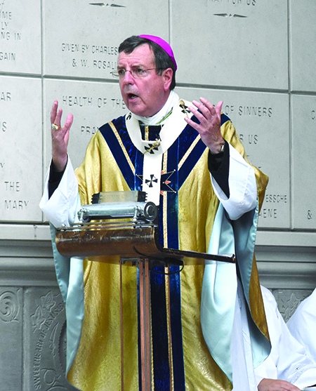 Archbishop Allen H. Vigneron gives a homily Aug. 15 at Assumption Grotto in Detroit.