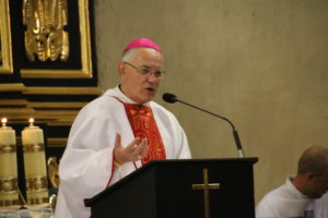 Detroit Auxiliary Bishop Donald F. Hanchon speaks during a Mass at St. Margaret and St. Catherine Church in Krakow with pilgrims from the Archdiocese of Detroit.