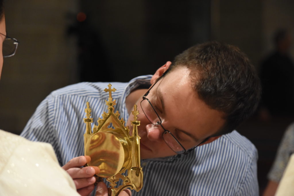 A man venerates a relic of St. Anne during an ecumenical celebration of the grandparents of Jesus at the Cathedral of the Most Blessed Sacrament on July 25. (Dan Meloy | The Michigan Catholic)