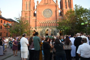 People gather outside of Ste. Anne de Detroit Parish during the feast of St. Anne on July 26. 