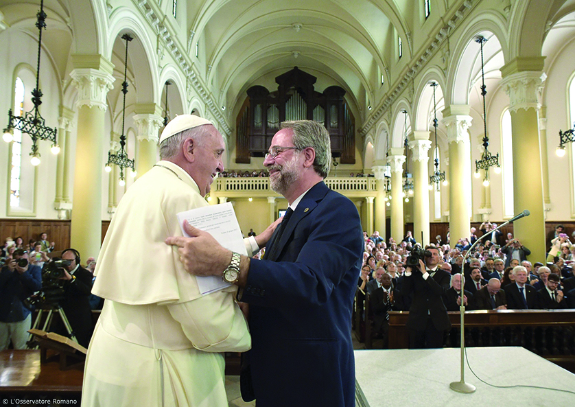 Pope Francis greets a pastor at a Waldensian church during a two-day pastoral visit to Turin, Italy, June 22. Pope Francis asked forgiveness for the Roman Catholic Church's "non-Christian and inhumane" treatment of the Protestant movement in the past. (CNS photo/L'Osservatore Romano via Reuters)