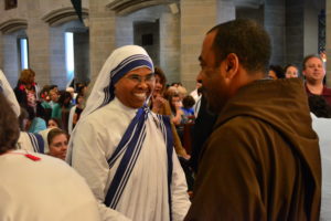 The Missionaries of Charity wear wide smiles as they greet Mass-goers afterward. 