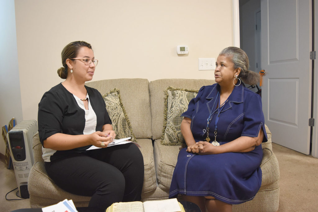 Gabi Hejka, an intern in the Madonna University Aging Studies program, sits and chats with Gewerl Summer Sept. 20. As part of her internship, Hejka visits senior housing residents and helps with paperwork, low-income housing eligibility and other matters.