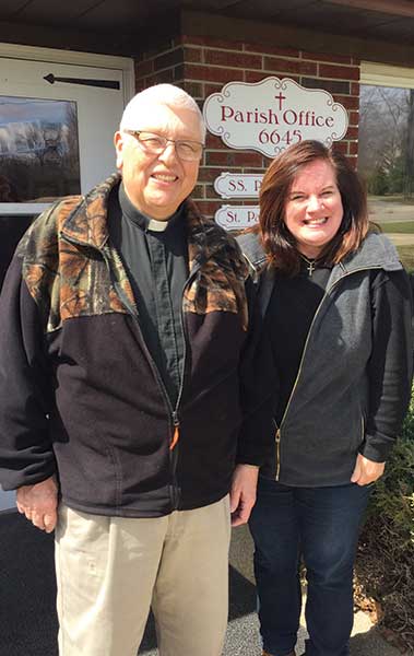 Paula Kaniut stands with her pastor
